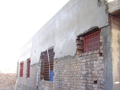 The exterior plastering still needed to be completed after construction was halted.