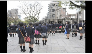 Japanese school girls visit the A-Bomb Dome. 